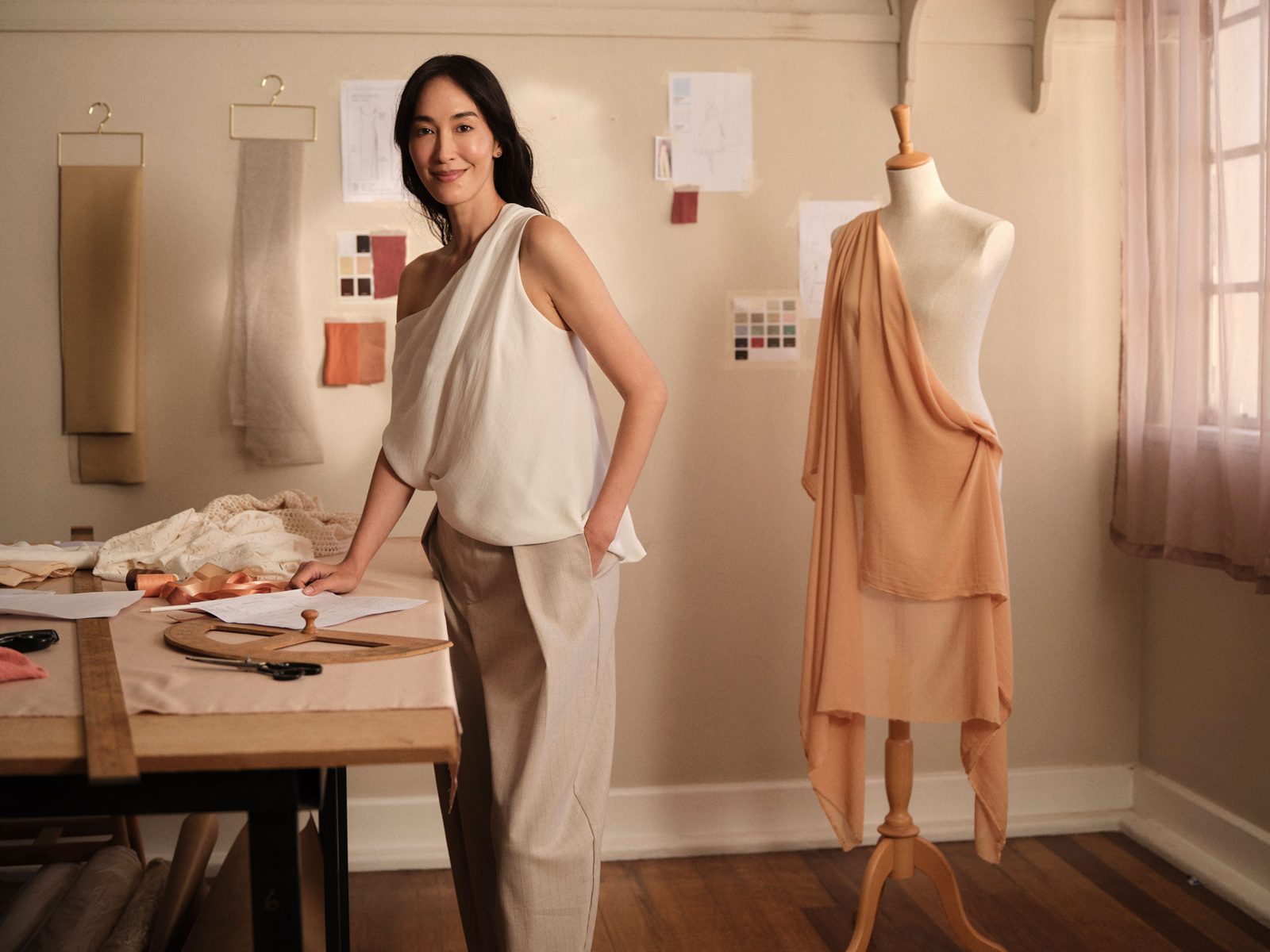 Dressmaker standing in her studio